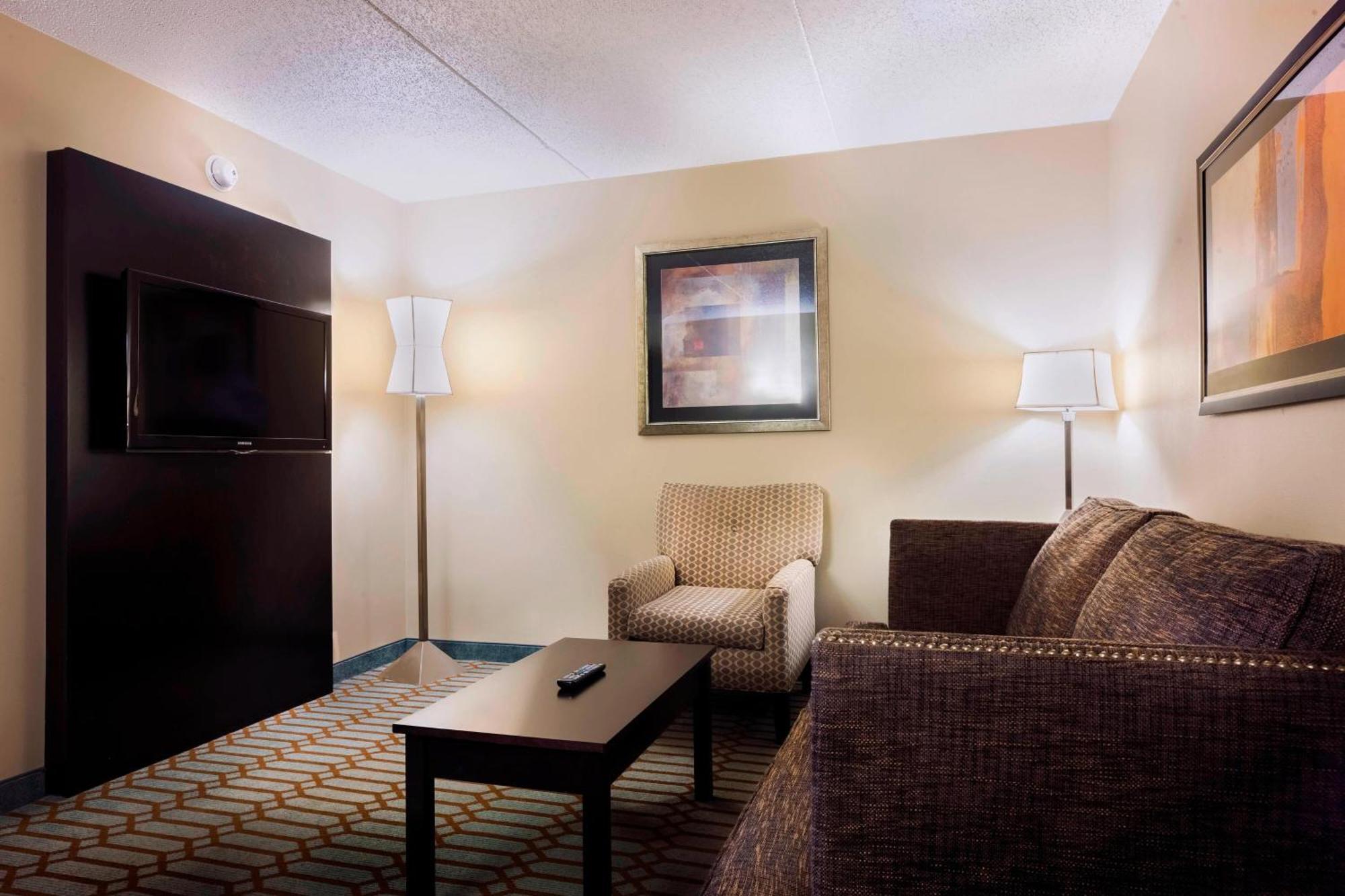 Guest Room with Two Queen Beds and One Sofa Bed - Pool View